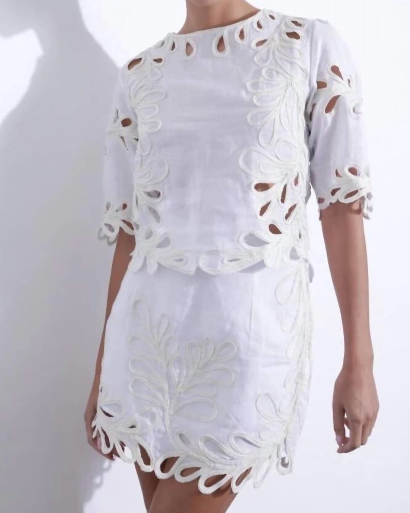 Front of a model wearing a size L Odile Embroidered Skirt in Off White in Off White by Karina Grimaldi. | dia_product_style_image_id:338565